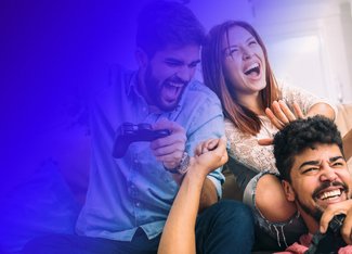 Three people getting excited while playing video games