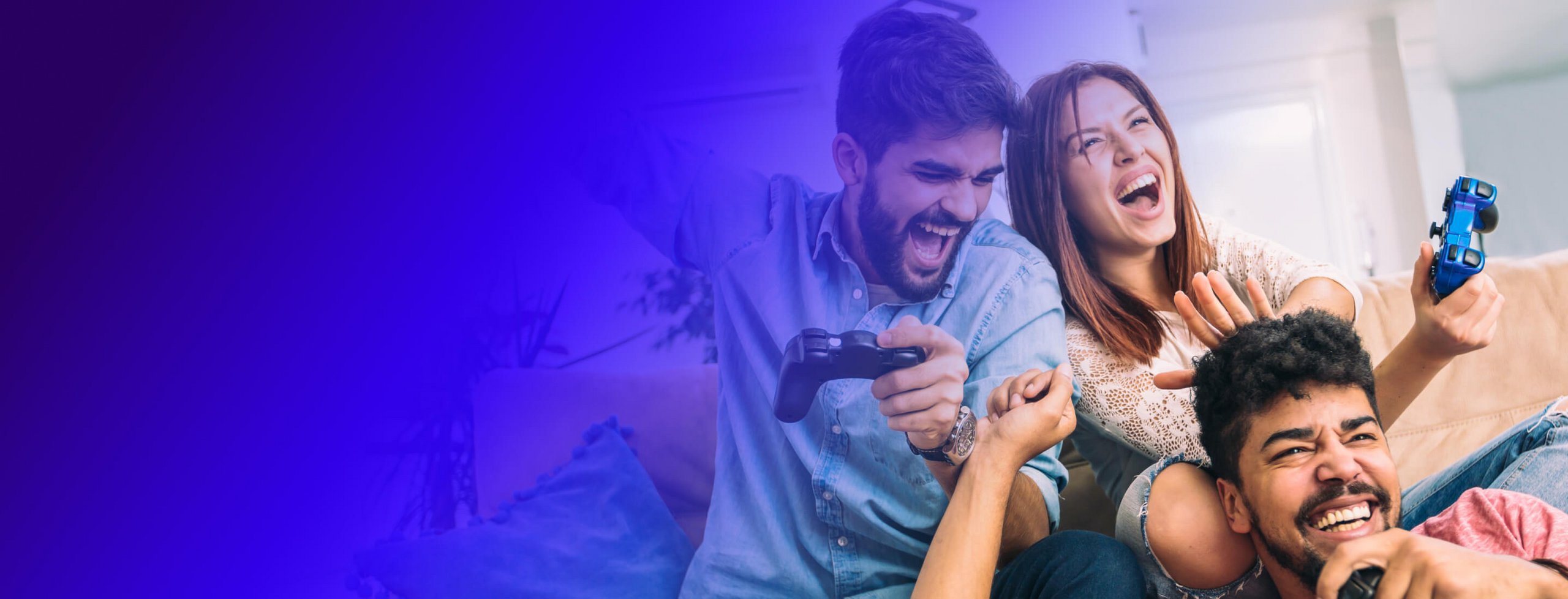 Three people getting excited while playing video games