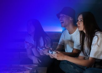 group of friends playing a video game together